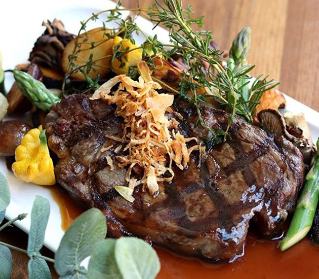 Steak dish with asparagus and other assorted veggies