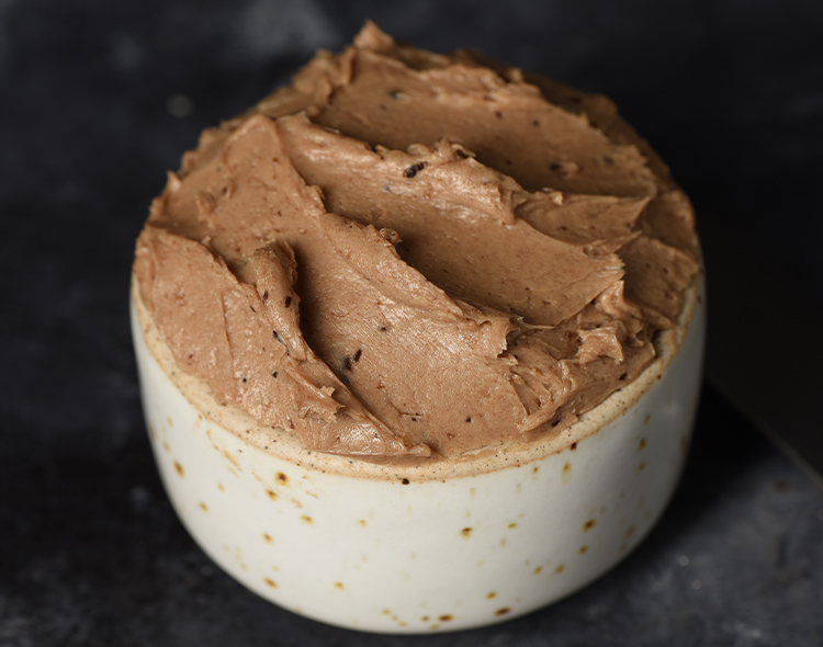 Fermented black garlic compound butter in a bowl