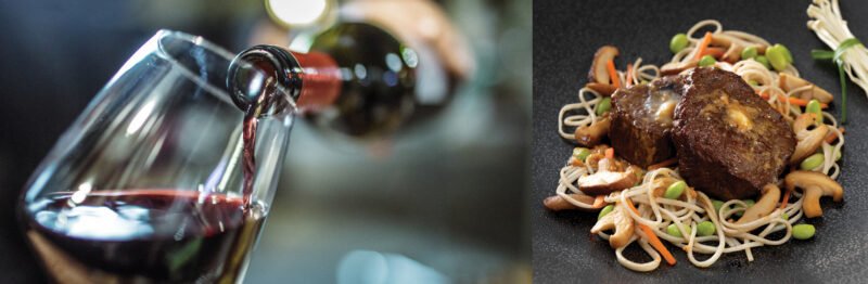 Pouring a glass of red wine alongside a beef dish