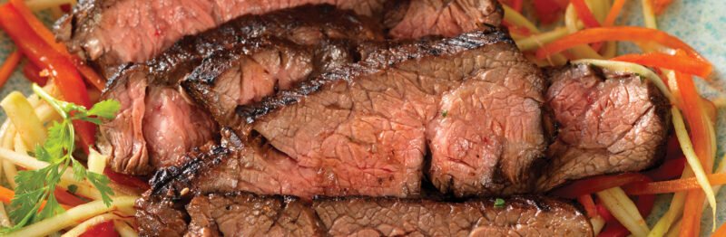 Cut of beef plated with garnish