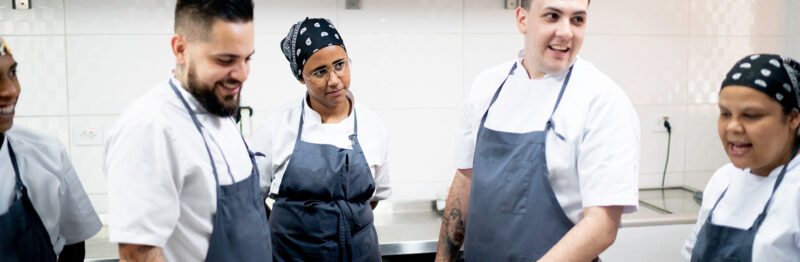 Chefs in a kitchen talking