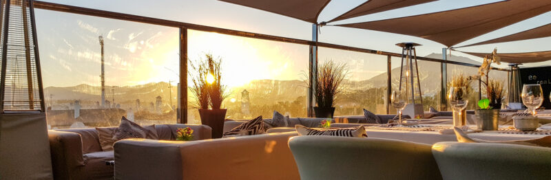 An empty restaurant patio during sunset